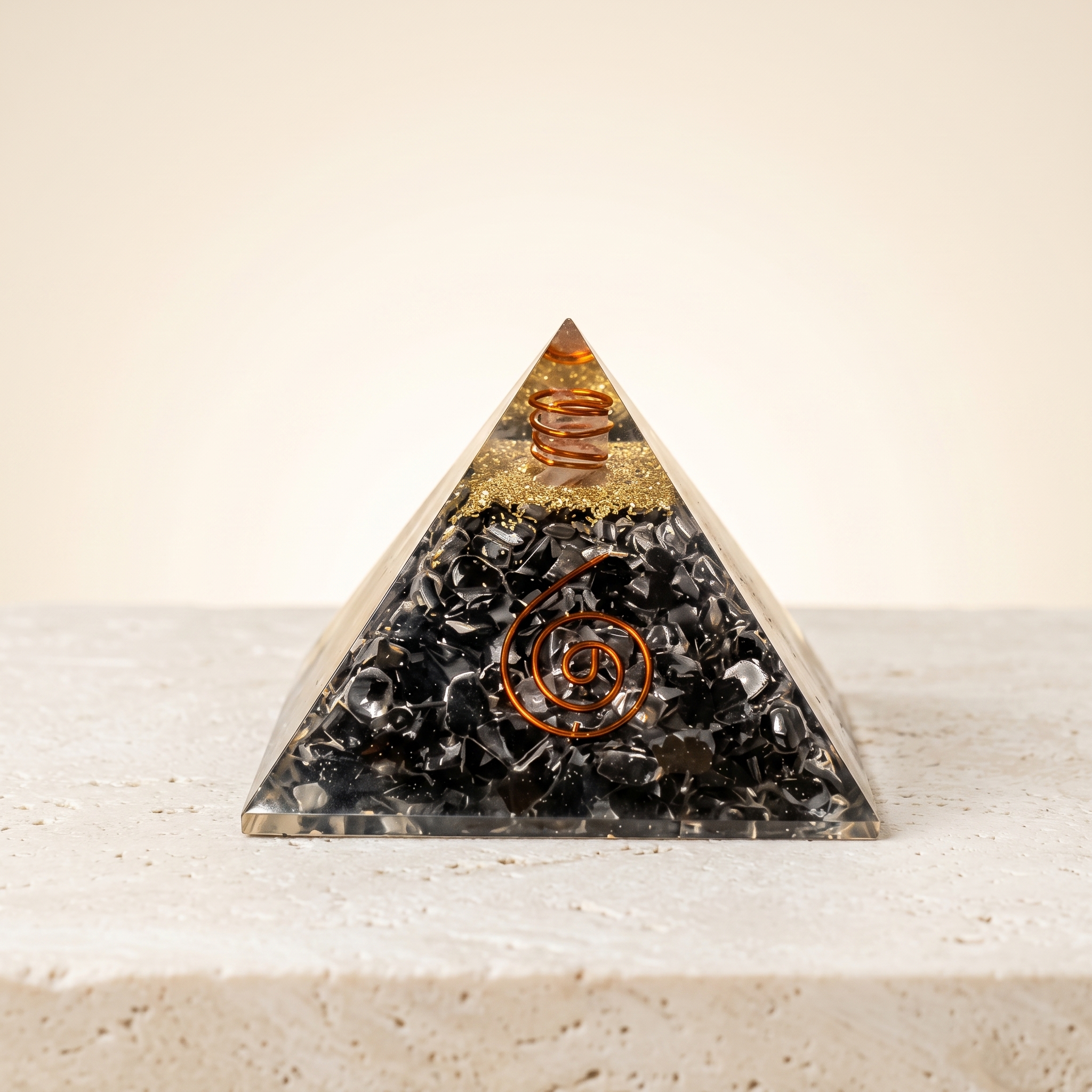 Orgonite_pyramid_on_stone_surface_202607070244