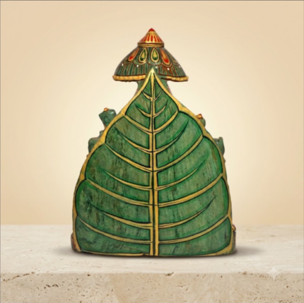 Lord Ganesha Idol on a Green Leaf